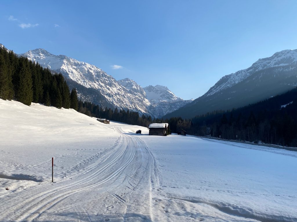 End of the valley in winter with cross-country ski trail.