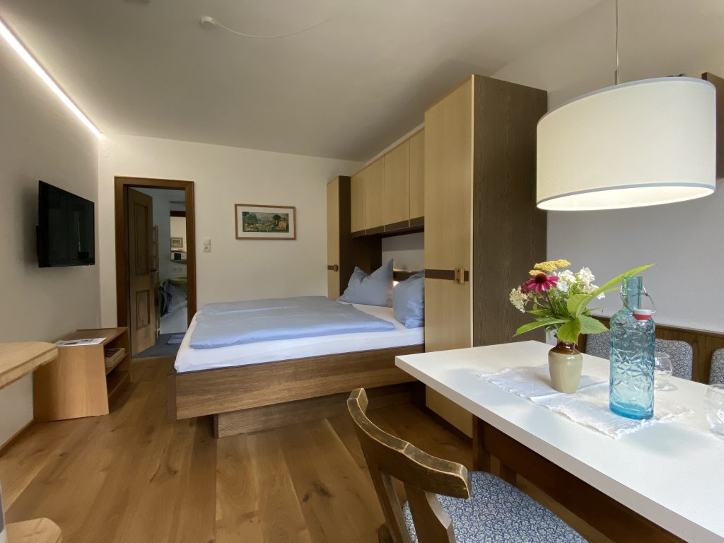 Sleeping and dining area in Apartment Kitzstein